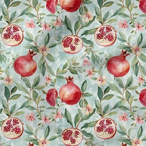 Könnte beinhalten: Aquarellmuster mit Granatäpfeln, ganz und halbiert, mit sichtbaren Samen. Das Design umfasst grüne Blätter, rosa Blüten und einen hellblauen Hintergrund, wodurch ein botanisches Thema entsteht.