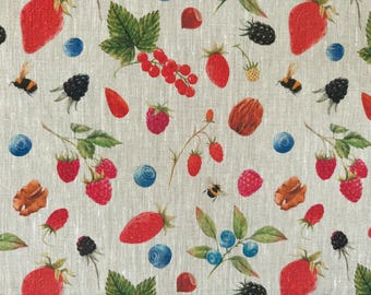 May include: A fabric pattern featuring a variety of watercolor-style berries, nuts, and bees on a light beige background. The design includes red strawberries, raspberries, and currants, along with blueberries, blackberries, and walnuts.