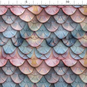 May include: A repeating pattern of overlapping, semi-circular shapes in shades of pink, blue, and yellow. The design resembles fish scales or roof tiles, with a textured, weathered appearance. The colour palette is soft and muted, creating a vintage aesthetic.