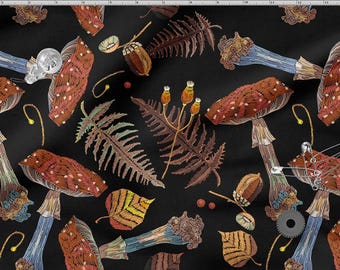 May include: Black fabric with an embroidered pattern of mushrooms, ferns, acorns, and leaves in brown, orange, and blue. The design includes small white dots on the mushroom caps and a few safety pins.