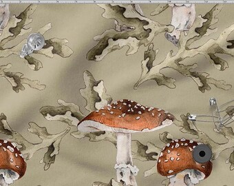 May include: A fabric pattern featuring watercolour illustrations of red-capped mushrooms with white spots, set against olive-green foliage and a light beige background. The design includes metallic embellishments.