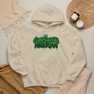 Felpa con cappuccio "La fiducia è nata in Nigeria" / Design con scritta "Orgoglio nigeriano"