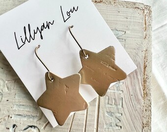 Gold modern earrings // shiny star earrings // holiday earrings // star dangle earrings // gold star // star earring // gold earrings