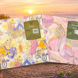 May include: Two sheets of vintage Barbie wrapping paper. One sheet has a pink background with Barbie and Ken, a rainbow, and a sailboat. The other sheet has a white background with Barbie, bicycles, and the words "Happy Birthday".