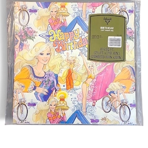 May include: Vintage birthday gift wrap featuring illustrations of a blonde woman in various poses, including riding a bicycle and holding a cake. The words "Happy Birthday" are prominently displayed. The package contains 8.5 sq. ft. of wrapping paper, with each sheet measuring 30 inches by 20 inches.
