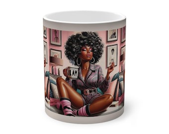 May include: A white ceramic mug featuring an illustration of a woman with dark curly hair, wearing a plaid outfit, and holding a mug with the text "I AM". The mug has a wraparound design with a pink and gray color scheme.