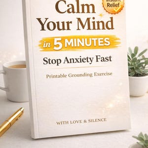 May include: A book titled "Calm Your Mind in 5 Minutes" with the subtitle "Stop Anxiety Fast." The cover is white with brown text and a gold accent. A coffee mug, a pen, and small potted plants are also visible.