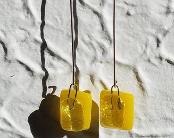 Bright yellow dichroic glass dangle earrings on thin silver plated wire