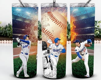 May include: A stainless steel tumbler featuring a baseball theme with the Los Angeles Dodgers team. The design includes baseball players, a baseball, and stadium lights. The tumbler has a silver straw and a clear lid.