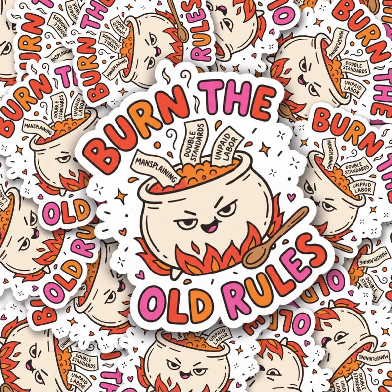 Op de afbeelding: Een gestanste sticker met een cartoonketel met een gezicht, zittend in oranje vlammen. De tekst luidt BURN THE OLD RULES. In de ketel zitten papieren met de labels MANSPLAINING, DOUBLE STANDARDS en UNPAID LABOR, met een houten lepel.