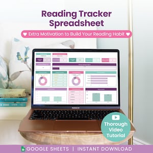 May include: A laptop screen shows a reading tracker spreadsheet with purple, teal, and white charts. The text "Reading Tracker Spreadsheet" is at the top. The laptop is on a wooden table next to books and a decorative cushion.