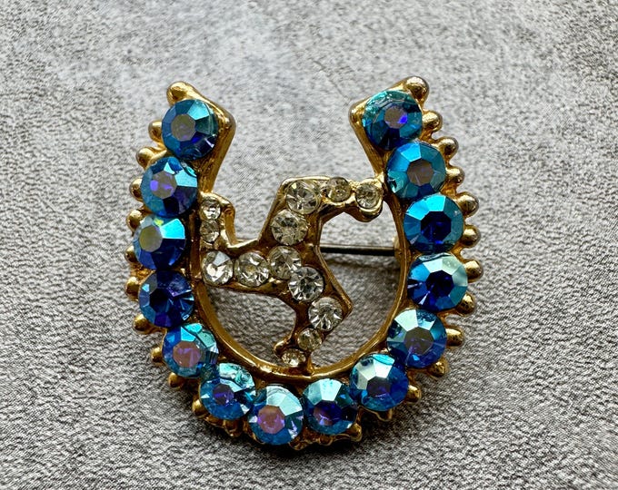 Vintage Isle of Man triskelion brooch | Lucky horseshoe rhinestone pin | Blue AB sparkle | Celtic symbol gift | re.