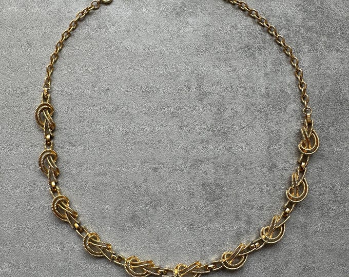 Signed Corocraft gold-plated knot necklace, adjustable 13–16 inch chain, vintage elegance, collectible jewellery
