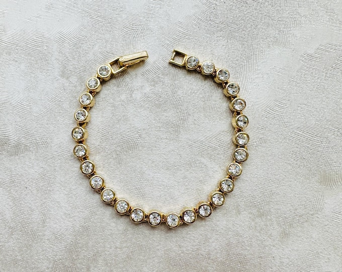 Pre-loved Avon tennis bracelet, gold tone with crystal stones, signed, 7 inch sparkle chain, gift for her, classic glamour style