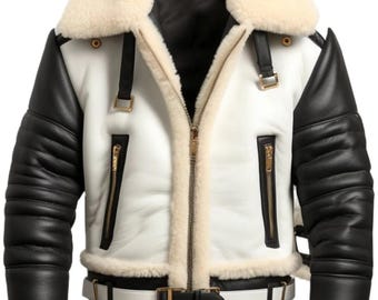 May include: A white and black leather jacket with a cream-colored shearling collar and lining. The jacket features black sleeves, gold zippers, and a white belt with a black buckle. The jacket has a classic aviator style.