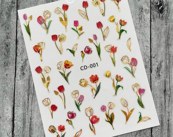 Pegatinas de uñas con flores de tulipán dorado: Mariquita roja, tallo morado y oro rosa.