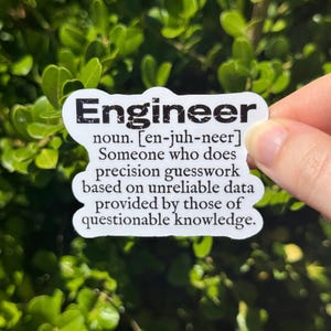 May include: A white sticker featuring the word "Engineer" in black, bold lettering. The sticker humorously defines an engineer as someone who does precision guesswork based on unreliable data from those of questionable knowledge.