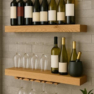 May include: Wooden wine rack with two shelves, holding various wine bottles and wine glasses. The top shelf displays red and white wine bottles with blank labels. The bottom shelf holds wine glasses, wine bottles, and a black wine chiller.