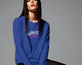 May include: Royal blue long-sleeve shirt with the text "RASCAL KING" in white and pink. The shirt has a crew neck and is made of a soft material. The shirt is a casual wear item.