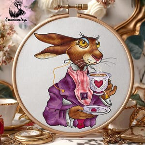 May include: A set of three ceramic mugs with a speckled, matte finish. The mugs are in shades of cream, light gray, and dark gray. Each mug has a simple, minimalist design and a rounded handle.