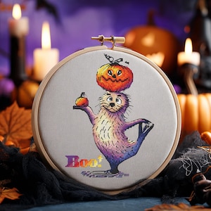 Schema punto croce per foca di Halloween con zucca in PDF