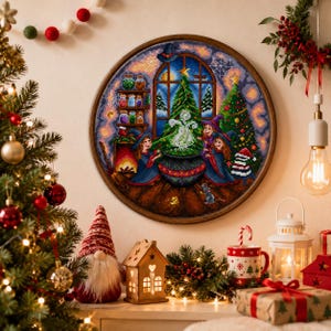 May include: A round, framed cross-stitch depicting three witches around a cauldron, with Christmas trees and a window scene. The artwork is in a wooden frame and features a festive holiday theme with a witchy twist.