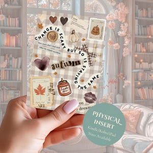 May include: A rectangular sticker sheet with a beige and white gingham pattern featuring various autumn-themed illustrations including a pumpkin, a candle, a maple leaf, hearts, and text that reads Change is scary but so is staying the same.