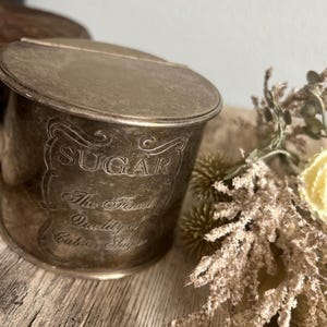 Silver plated, engraved sugar container with patina