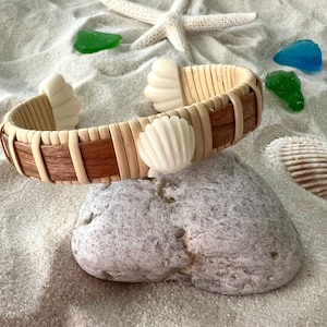 Nantucket bracelet woven with natural cane and cherry wood, embellished with a shell