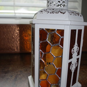 Honeycomb lantern with flickering LED candle