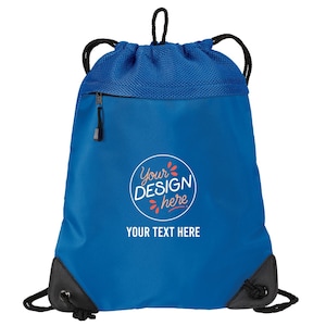 May include: A blue drawstring backpack with a black drawstring and accents. The bag has a zippered pocket and a mesh top. The text "Your Design Here" and "Your Text Here" are printed on the front.
