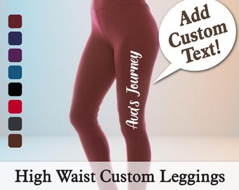 May include: Burgundy high-waist leggings with the text "Ava's Journey" in white script. The leggings are shown with a selection of colour swatches and a speech bubble that says "Add Custom Text!" at the top right.