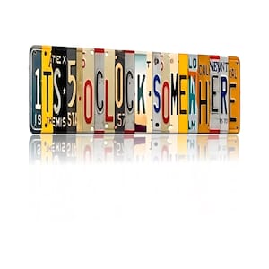 May include: A metal sign made of repurposed license plates spelling out "It's 5 O'Clock Somewhere".