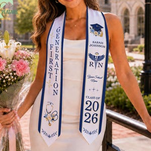 May include: A white graduation sash with navy blue trim and text. The sash reads "Generation First" and "Class of 2026." It features a nursing symbol and a graduation cap illustration. The person is holding a bouquet of pink flowers.