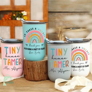 May include: Four insulated tumblers in pastel shades, each with a unique design. One says "Tiny Human Tamer" and "Mrs. Alyssa", another says "It Takes a Village" with a rainbow, and the others have similar designs. The tumblers have black lids.
