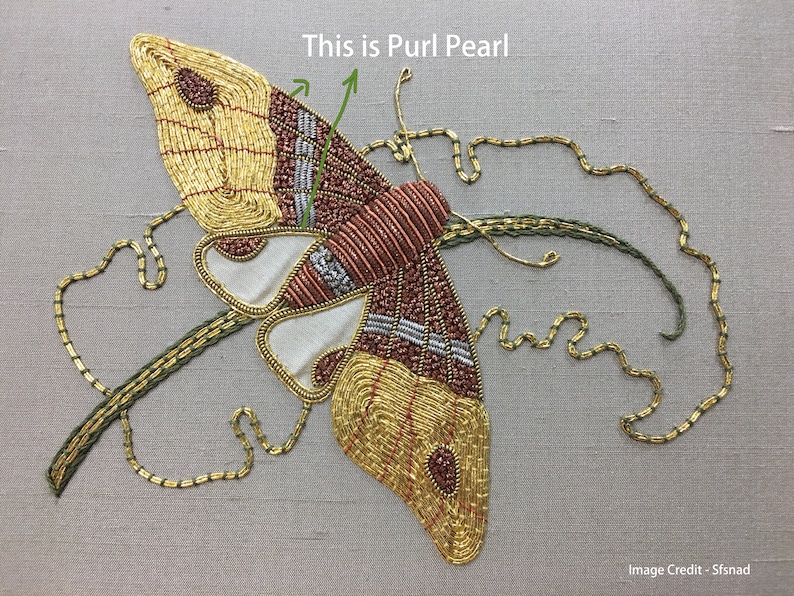 May include: A close-up of a gold, brown, and white embroidered butterfly with the text "This is Purl Pearl" above it.