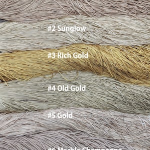 May include: Six different colors of metallic wire, labeled #1 Tuscan Sun, #2 Sunglow, #3 Rich Gold, #4 Old Gold, #5 Gold, and #6 Marble Champagne.