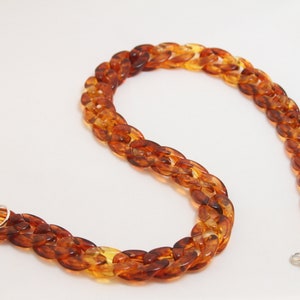 Orange tinted brown Tortoise Shell Mask Chain