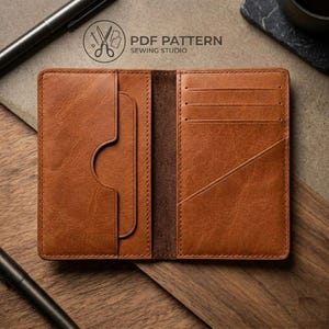 May include: Open brown leather wallet with multiple card slots and a bill compartment. The wallet is open, revealing the interior design. The text "PDF PATTERN SEWING STUDIO" is visible in the upper right corner.