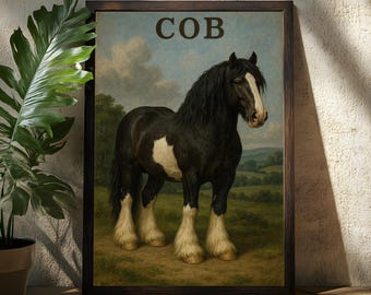 May include: Framed art print featuring a black and white Cob horse in a pastoral landscape. The horse has a white blaze and white markings on its legs. The word "COB" is printed at the top of the print in brown letters. The print is in a dark brown wooden frame.