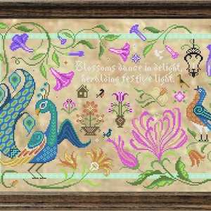 May include: A cross-stitch embroidery pattern featuring a peacock with a blue and green tail, surrounded by flowers and vines. The text "Blossoms dance in delight, heralding festive light." is included in the design.