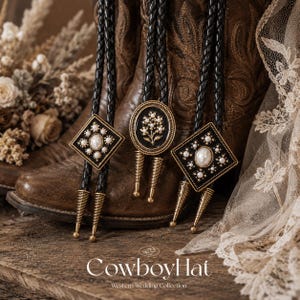 May include: Three bolo ties with black braided cords and decorative gold and black pendants. The pendants feature pearl accents and floral designs. The background includes brown cowboy boots and the text "CowboyHat Western Wedding Collection."