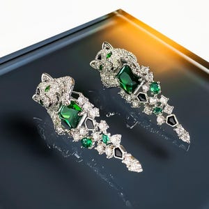 Platinum Panther Earrings – Sculpted Feline Design with Emerald and Crystal Pavé