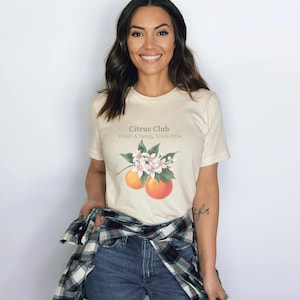 Vintage Citrus Club-T-shirt: retro oranje T-shirt met grafische print, botanische tuinstijl