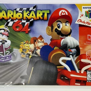 May include: A metal sign featuring the Mario Kart 64 video game. The artwork shows Mario, Wario, and Donkey Kong in their karts racing on a track. The Nintendo 64 logo and the text "Only For" are also visible.