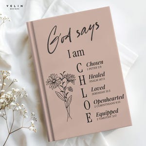 May include: A dusty rose hardback journal featuring the black text God says I am CHLOE with a floral line drawing. The vertical letters C, H, L, O, E correspond to the words Chosen, Healed, Loved, Openhearted, and Equipped with Bible verses.