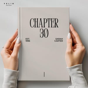 May include: A light gray hardcover book featuring the black text "CHAPTER 30" centered at the top. Below this, the text "EST. 1996" appears on the left and "SARAH CARTER" on the right. A small vertical black line is positioned near the bottom center.
