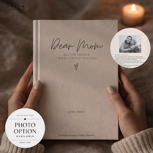 May include: A beige hardback journal with the text Dear Mom ALL THE THINGS I WISH I COULD TELL YOU, a small heart icon, the text LOVE, EMILY, and the text In loving memory of Mary Stevens. A circular inset shows a black and white photo of two people.