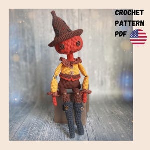 May include: A handmade crochet doll with a pumpkin-shaped head, wearing a brown witch hat and a yellow and brown outfit. The doll has button eyes and is sitting. The text "CROCHET PATTERN PDF" is visible. The American flag is also visible.