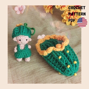 May include: A handmade crochet doll and a green and yellow crochet case. The doll is wearing a green outfit and hat. The case is green with yellow trim and small yellow accents. The image also includes the text "CROCHET PATTERN PDF" and an American flag.